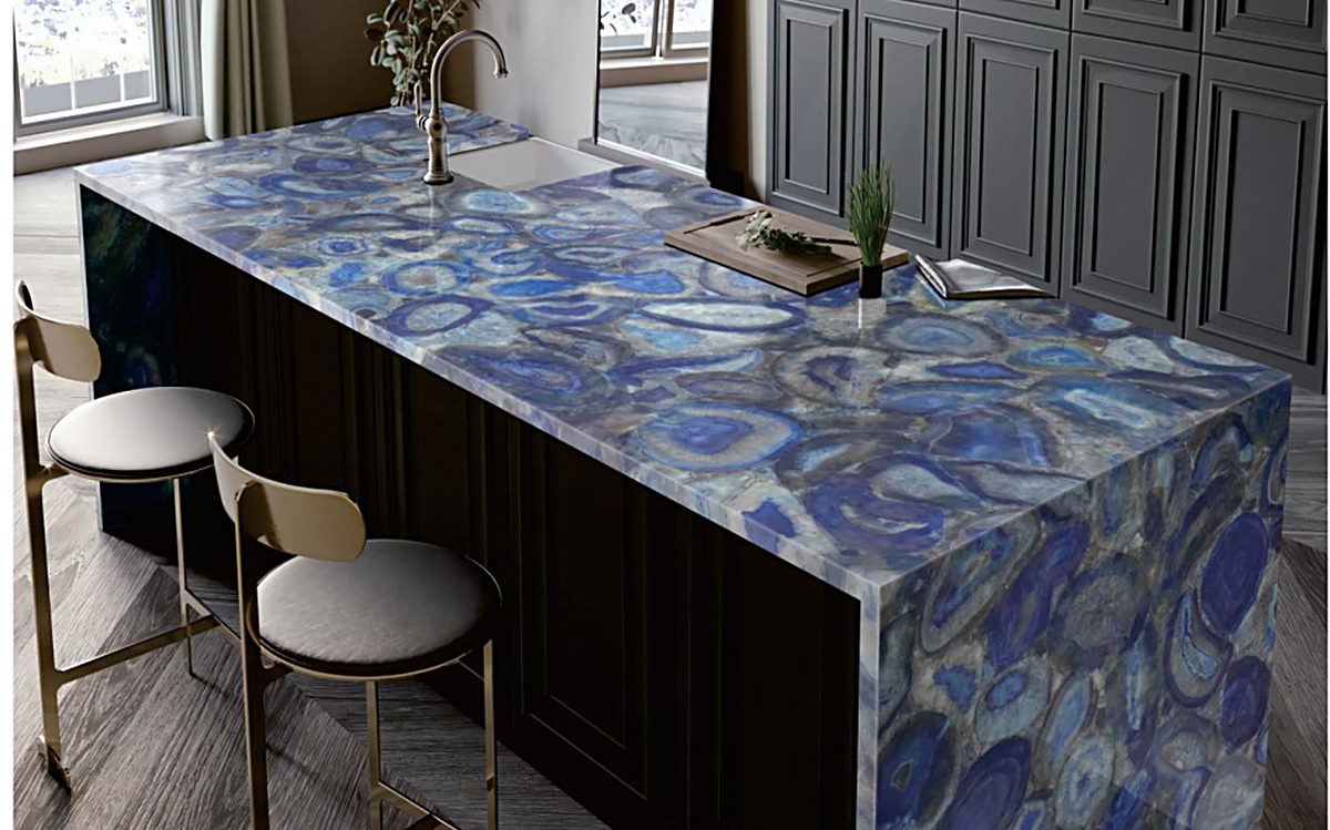 Bar island clad in agate-blue quartz slab with white bar top and seating