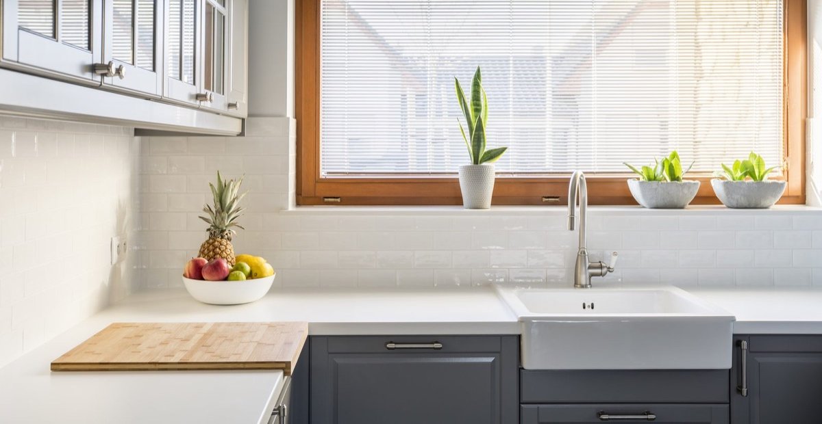 Bright residential kitchen with white quartz countertops — browse the Versa Stone quartz collection