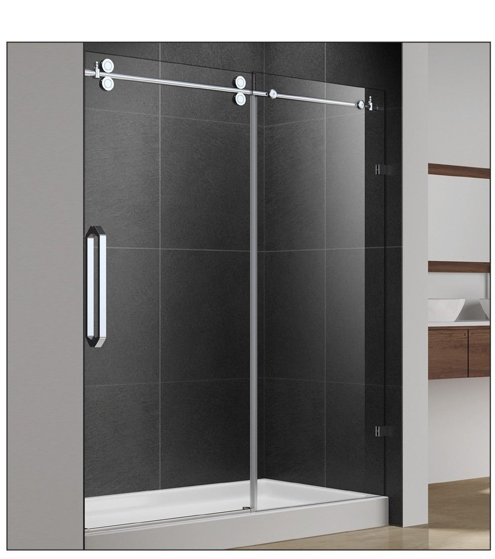 Frameless sliding glass shower door in a dark-tile bathroom