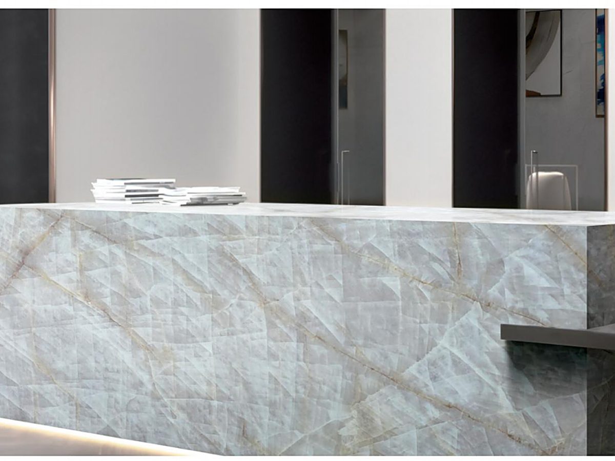 Commercial reception bar clad in natural stone with a stone countertop
